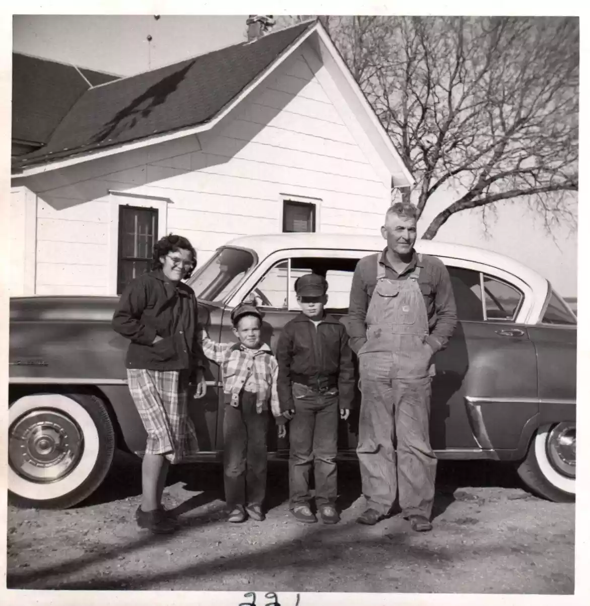 221 - family in front of car